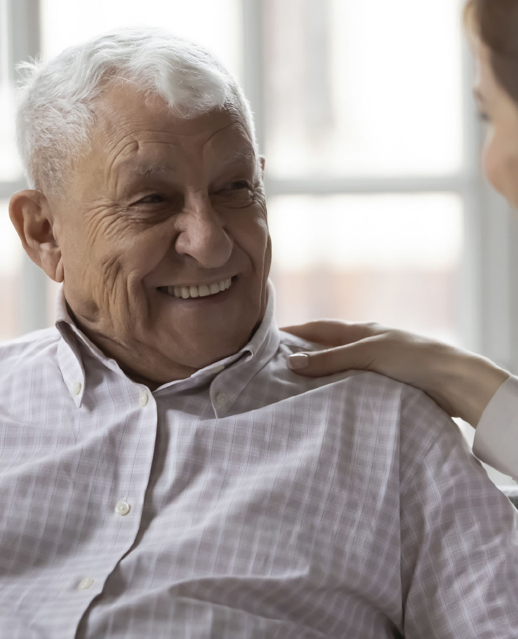 Close up image of a patient being reassured by a physician